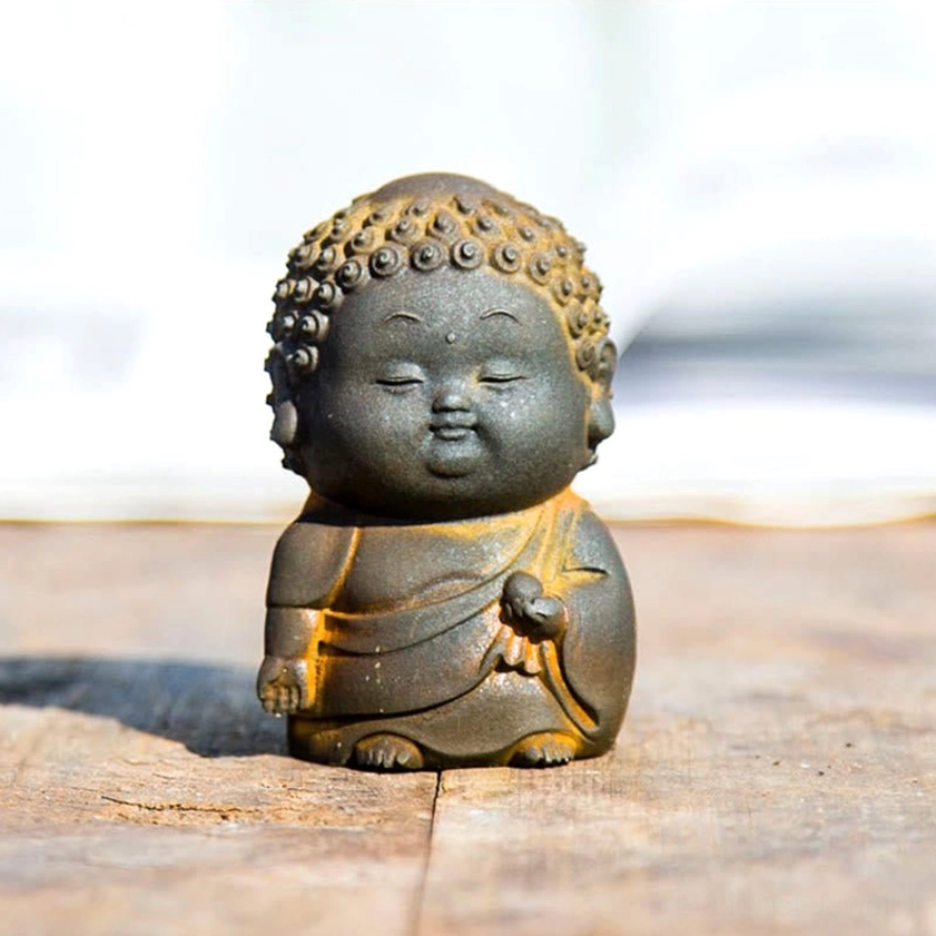 Three Buddha statue poses arranged together showing standing sitting and reclining meditative positions
