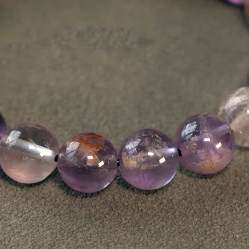 Clear quartz purple phantom and rutilated quartz beads showing all three crystal types together