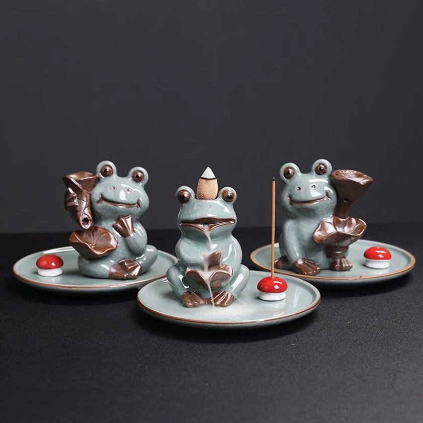 Three-piece frog incense burner set display showing multiple ceramic burners with red mushroom stands and stick incense holders