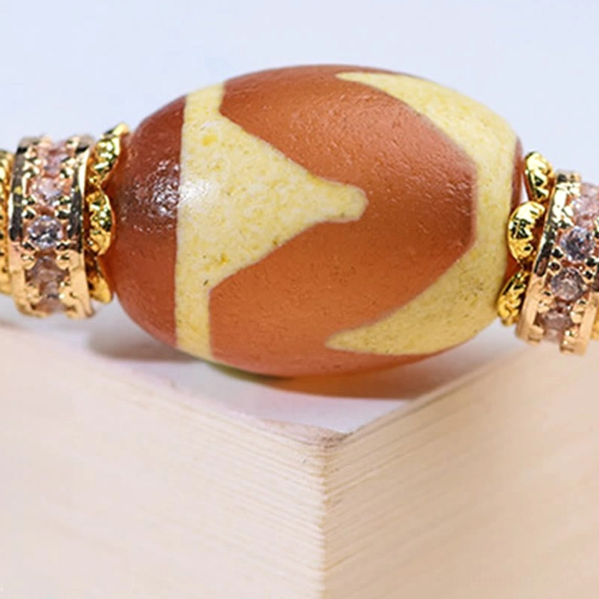Tibetan-inspired nine-eye dzi bead Buddhist bracelet for protection, prosperity, and inner peace