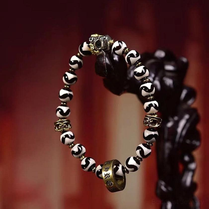 Oblique Side Angle of Hand-Painted Dzi Bead Buddhist Bracelet with Vintage Copper Spacers and Wave-Pattern Details
