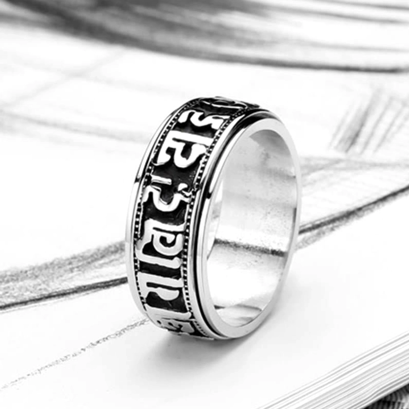 Tibetan Buddhist mantra spinner ring with antiqued silver finish and Sanskrit engravings