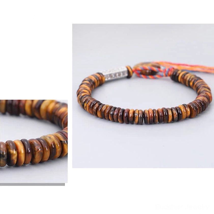 Tiny natural tiger eye disc beads with distinct brown-yellow color banding close-up shot