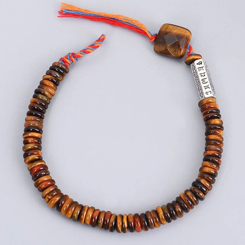 Tiger eye Buddhist bracelet adjustable cord showing craftsmanship and natural stone authenticity