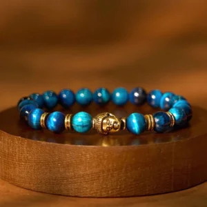Lake Blue Tiger Eye Buddha Bracelet with Gold-Toned Accents – Top-Down View