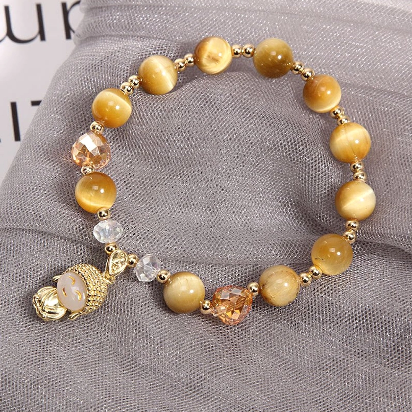 Tiger eye protection bracelet with Buddha pendant and mixed faceted crystal beads arrangement