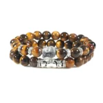 Handcrafted two-piece Buddhist protection bracelet set with tiger eye beads and silver Buddha charm on white background