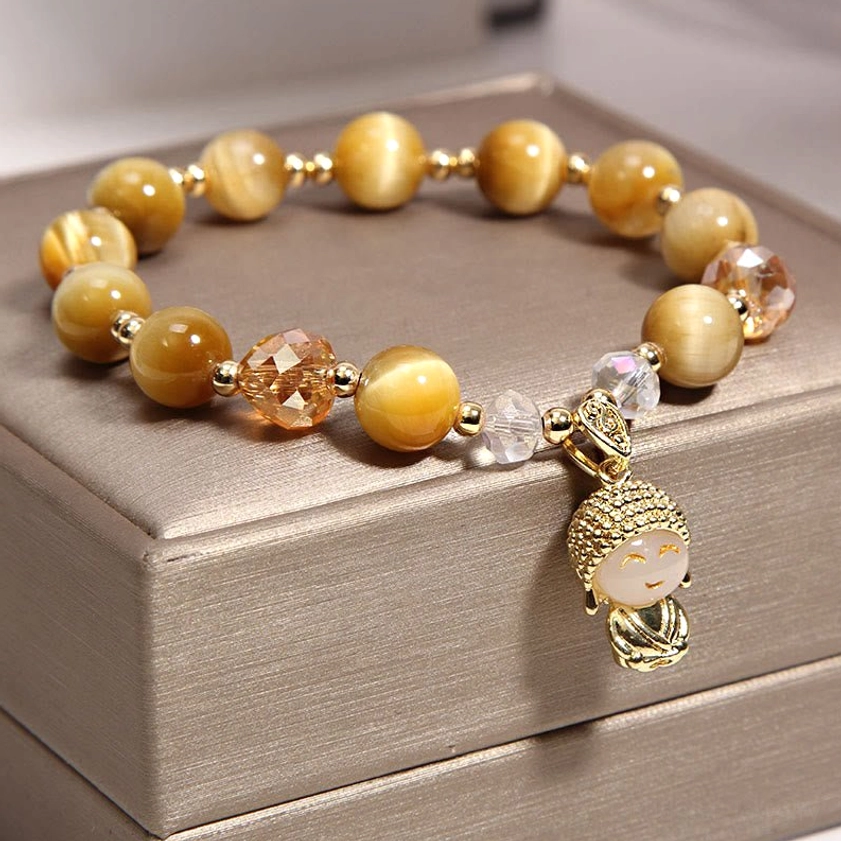 Tiger eye Buddhist bracelet with faceted crystal beads and Buddha charm featuring classic cat's eye striations