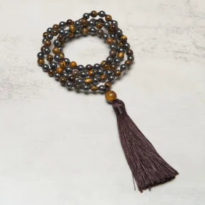 108 bead tiger eye hematite prayer mala necklace close-up overhead view with dark brown tassel