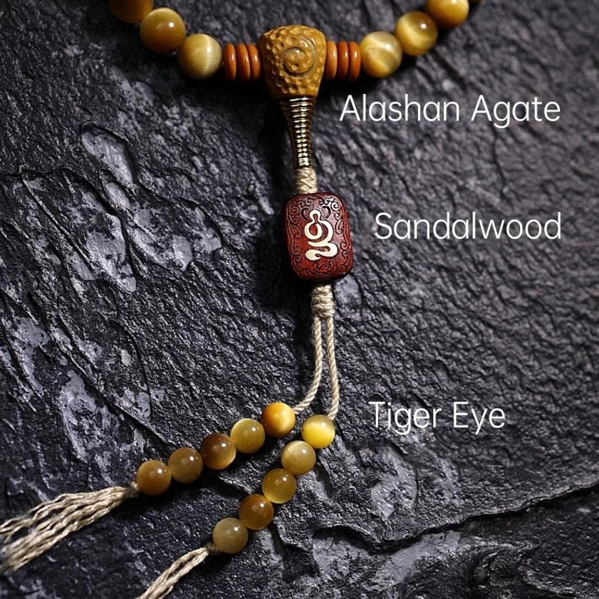 108 Mala Beads guru bead assembly featuring Tiger Eye, Sandalwood, Agate components with knotted tassel counter