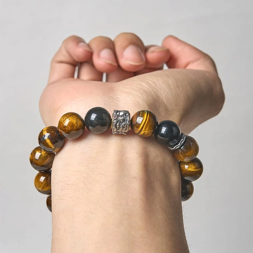 Handmade Buddhist bracelet on left hand demonstrating proper wear and snug fit for meditation and daily protection