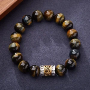 Tiger eye six true words bracelet featuring polished golden-brown striped beads with vintage silver-gold Om Mani Padme Hum engraved mantra charm