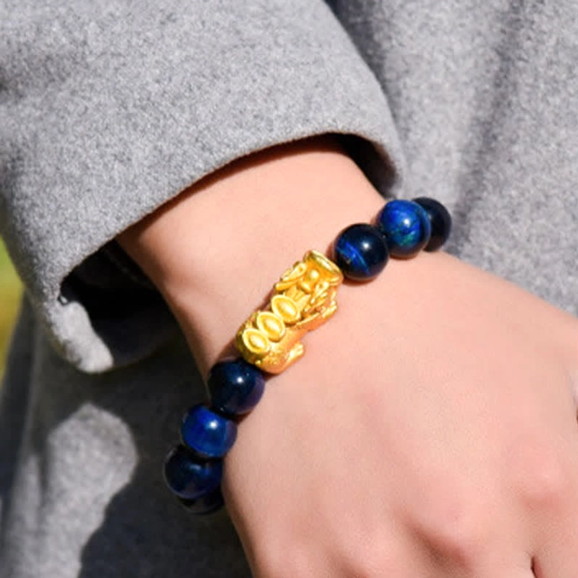 Multiple tiger eye Pixiu bracelet styles displayed together collection