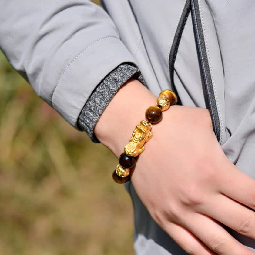 Tiger Eye Pixiu bracelet worn on wrist, close-up casual wear demonstration