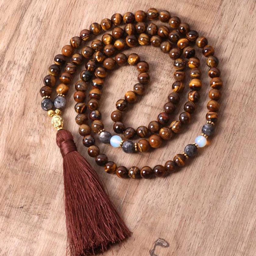 Close-up detail view of polished tiger eye stone beads in tight spiral coil, showcasing natural golden striping and lustre of each 8mm bead