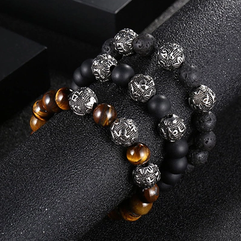 Tiger eye and titanium steel Buddhist bracelet showcasing natural stone patterns and sacred mantra engravings