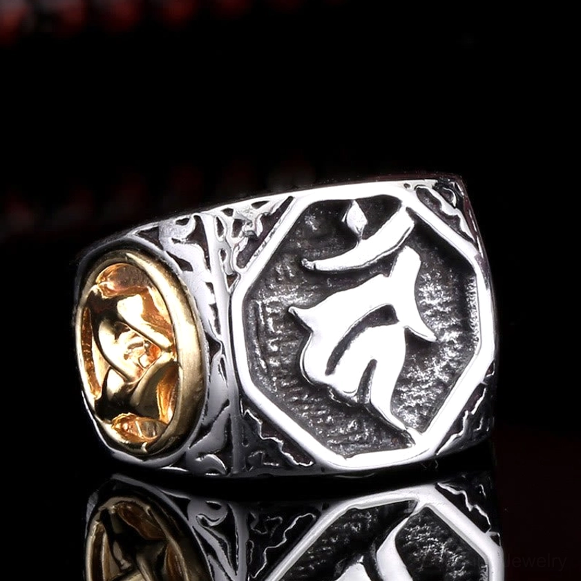 Titanium steel Sanskrit blessing ring front three-quarter view showing dual-tone vintage carved design with blessing hand gesture