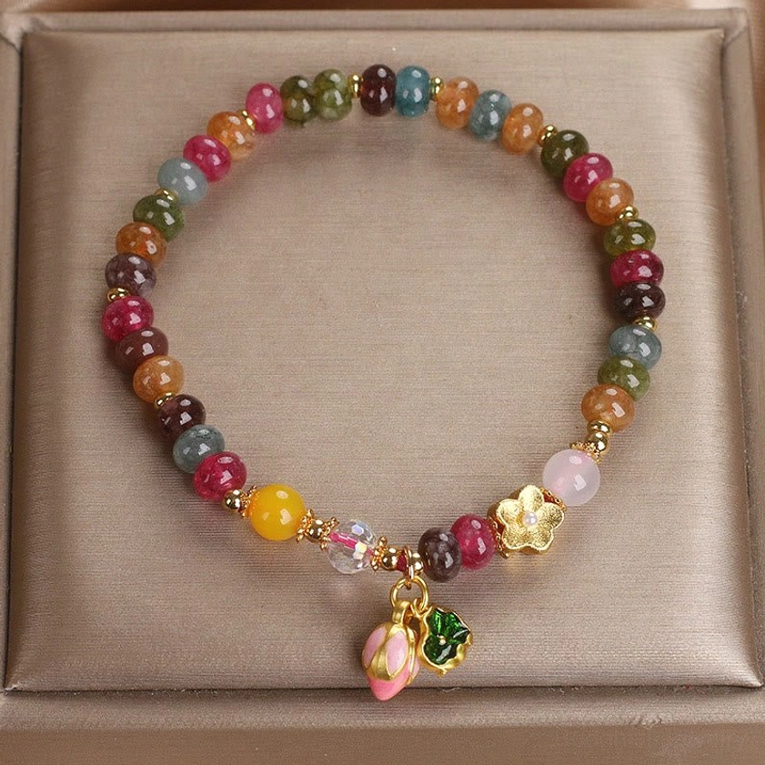 Tourmaline lotus seedpod bracelet for wisdom and spiritual growth, handcrafted multicolor beads with pink lotus charm