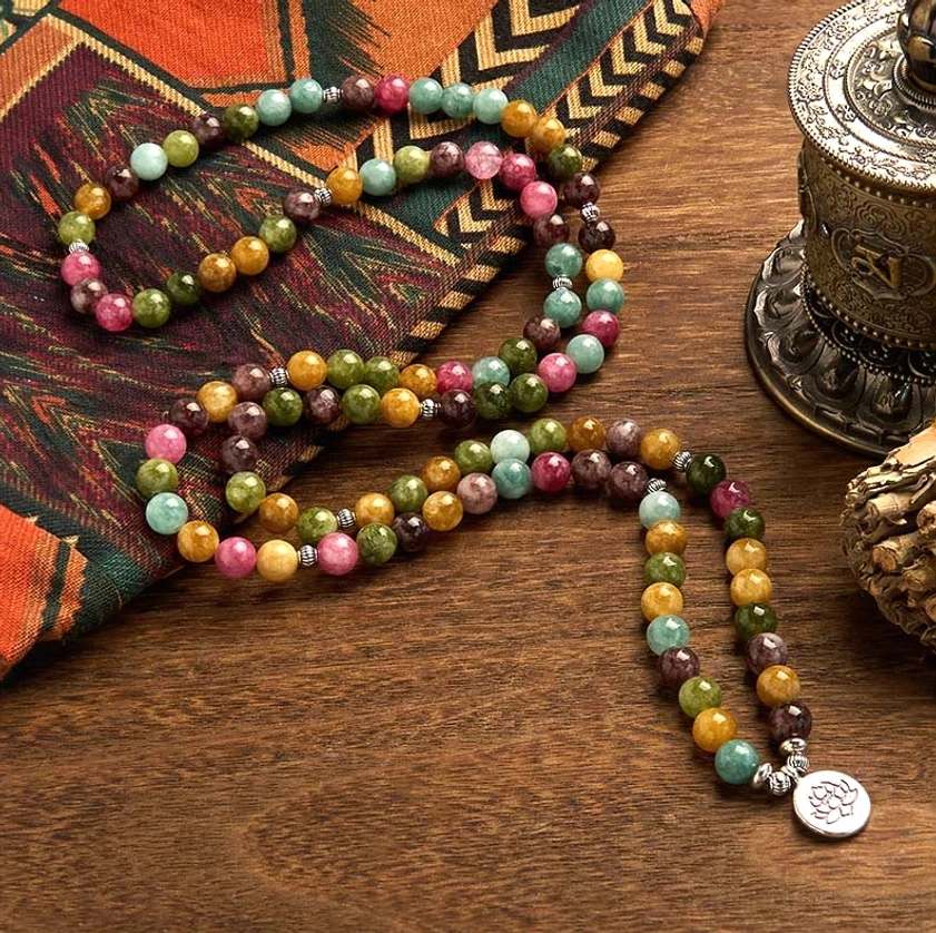 Draped tourmaline Buddhist mala bracelet with polished multicolor beads and lotus pendant detail