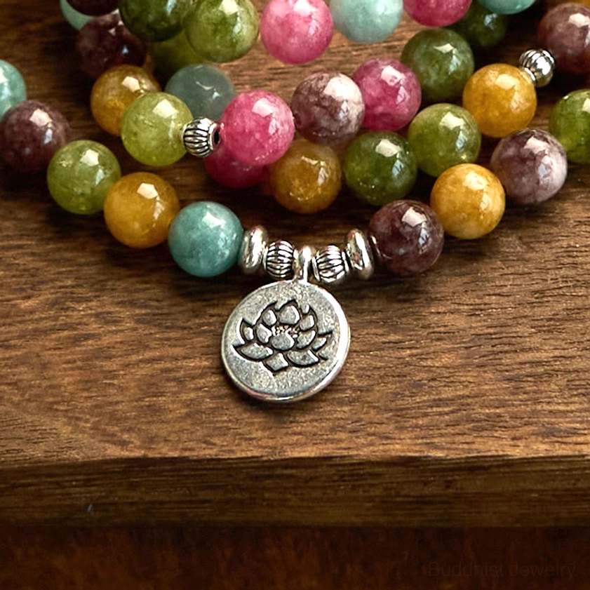 Detailed close-up of tourmaline mala bracelet showing polished natural stones and silver metal accents