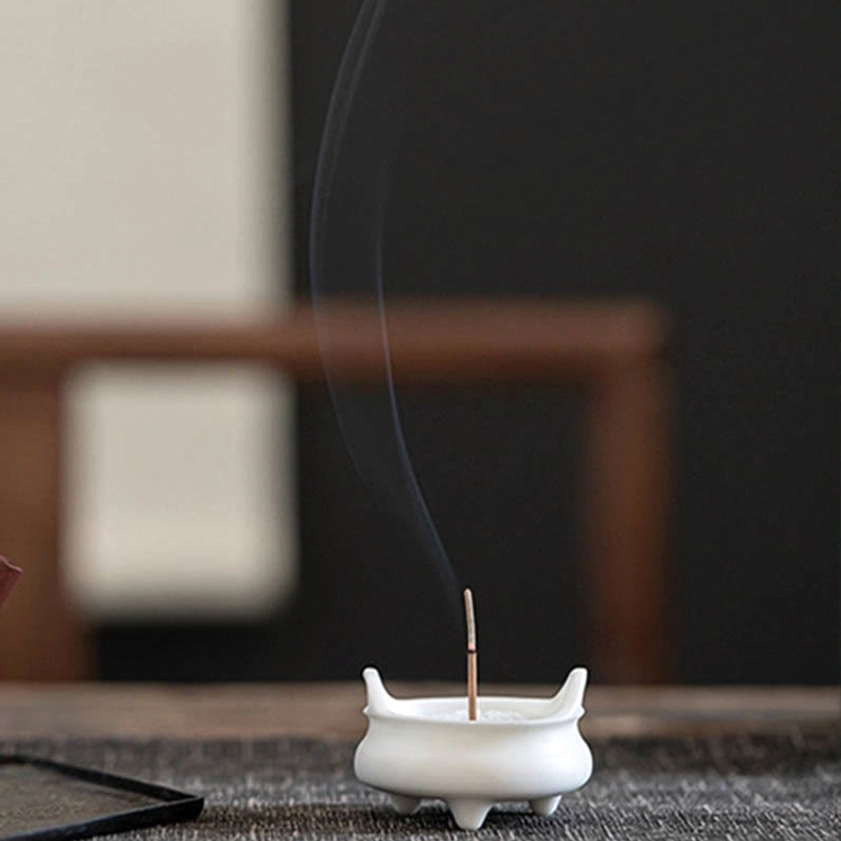 Buddhist ceramic incense holder with traditional dragon pattern symbolizing wisdom and spiritual protection