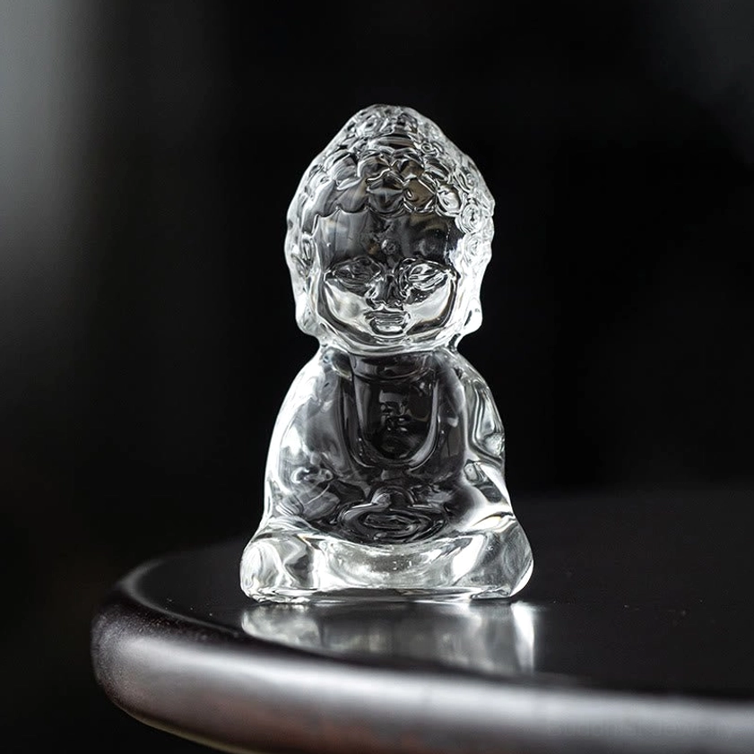 Transparent Liuli Buddha glass statue meditation pose with illuminated translucent finish