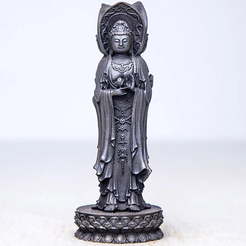 Avalokitesvara resin statue showing weathered patina and spiritual presence in home setting