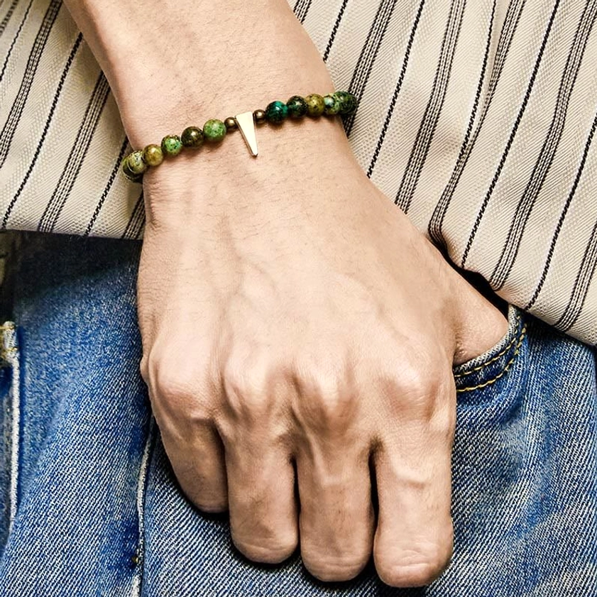 Front view of turquoise copper healing bracelet on wrist with vintage stone and copper hardware details