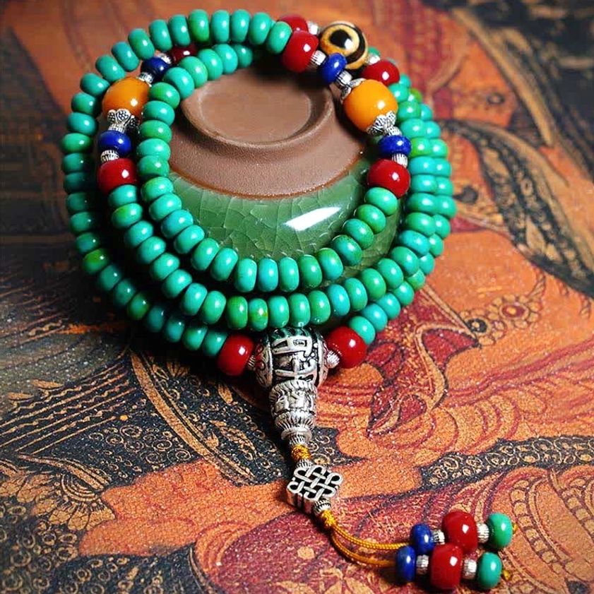 Turquoise Buddhist mala bracelet 108 beads with hand-painted dzi and silver tassel pendant