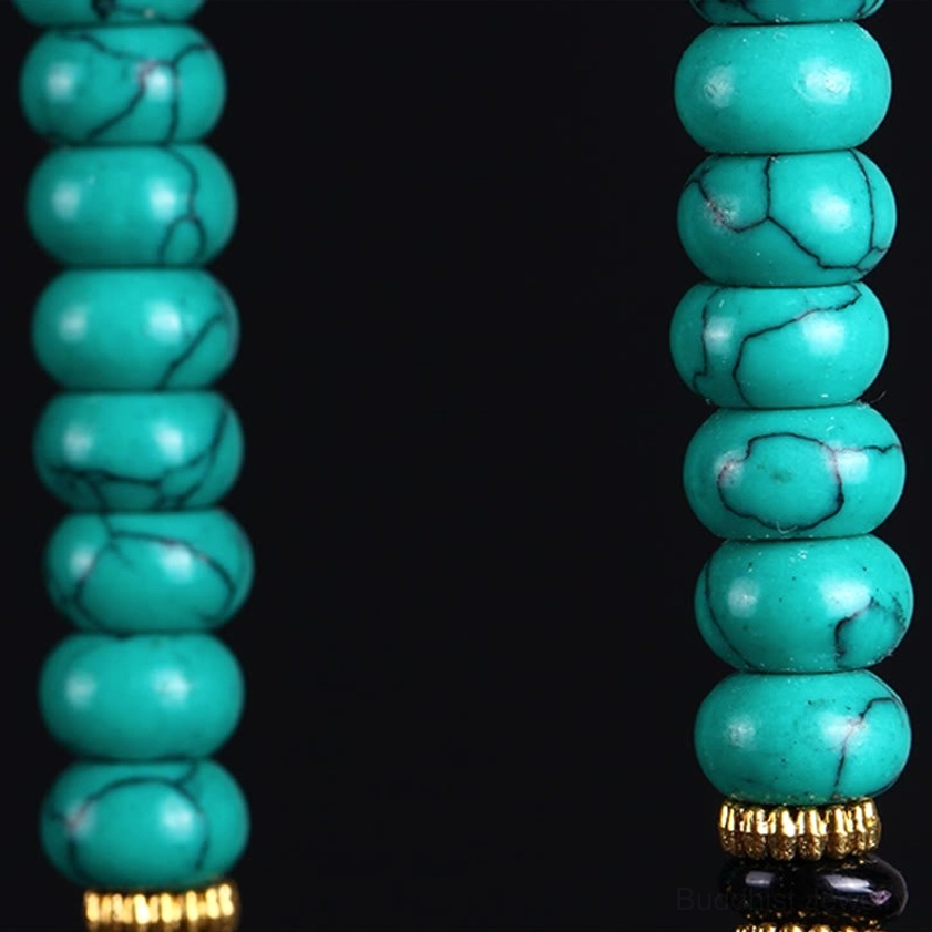 Rondelle turquoise prayer beads with gold spacer rings detail shot