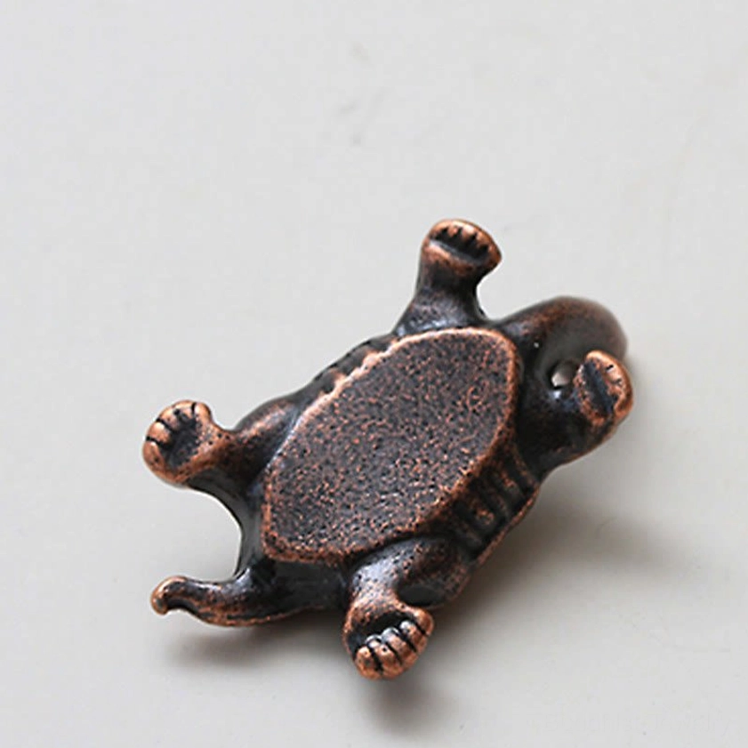 Turtle incense holder base bottom view showing flat bottom plate with detailed claw carvings in dark bronze
