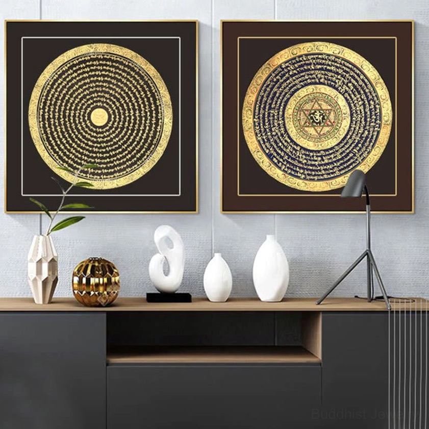 Twin set of hand-painted Buddhist thangka paintings arranged on entrance console wall, featuring dark brown frames with gilded sacred mantra designs