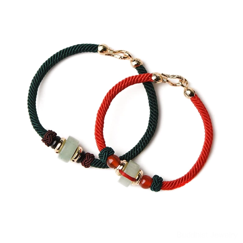 Unisex Buddhist string bracelet featuring natural green aventurine stones and red sacred thread