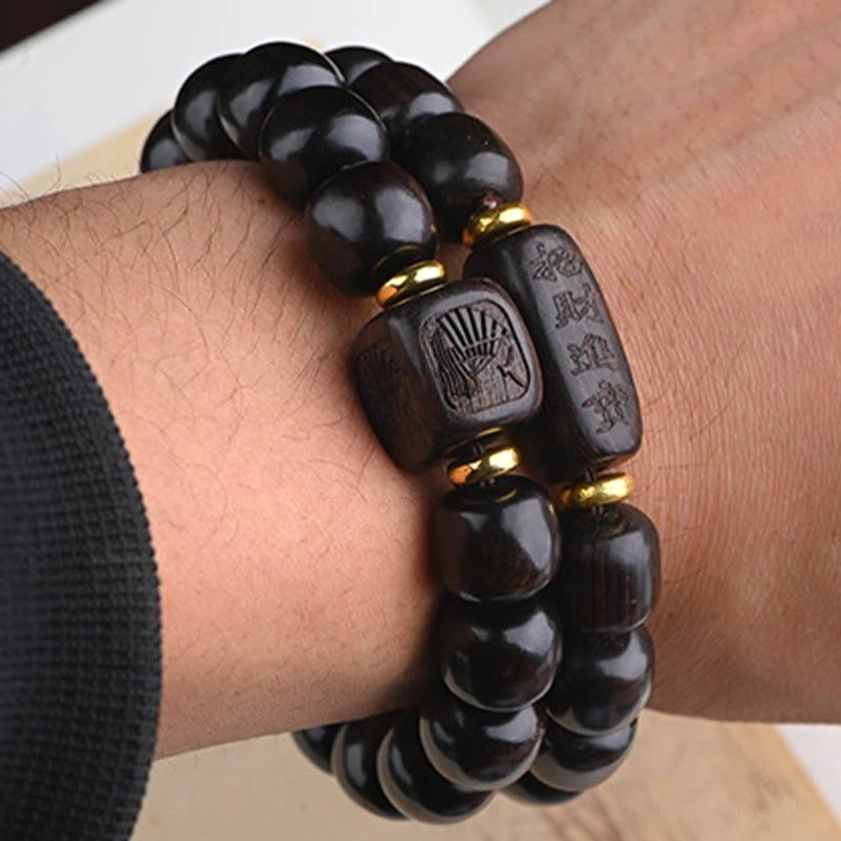 Unisex ebony wood barrel bead bracelet with natural wood grain and traditional Buddhist craftsmanship