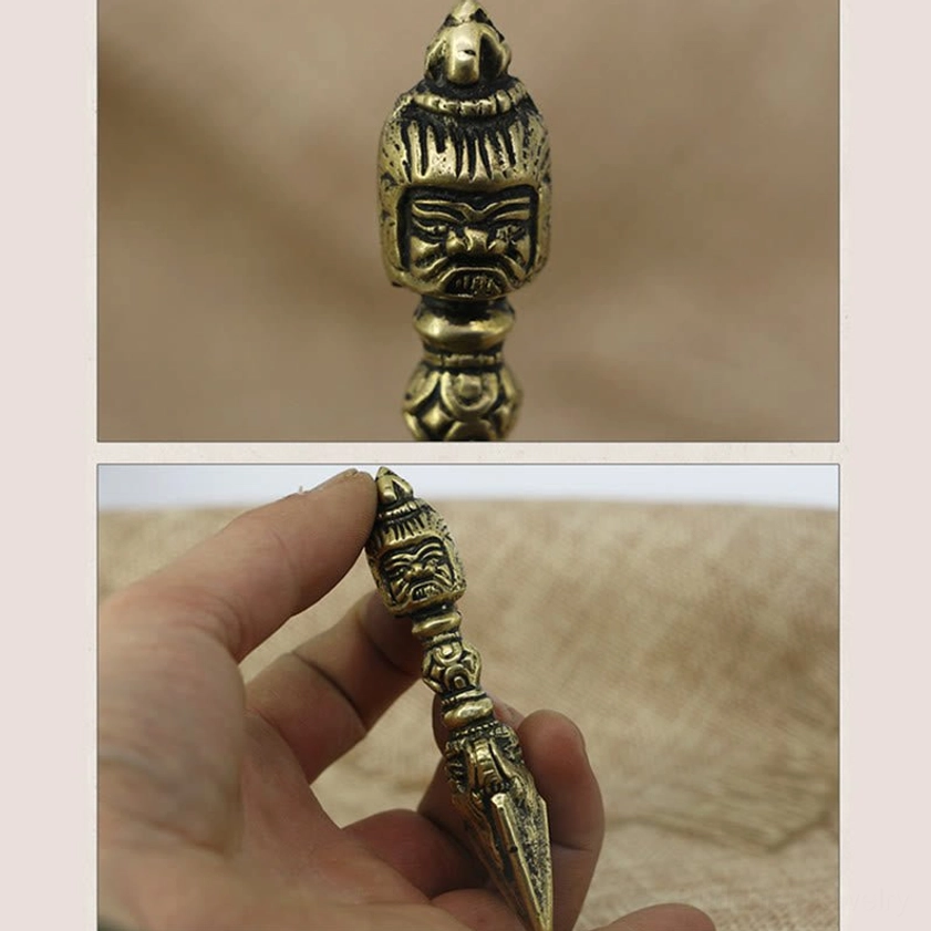 Vajra dorje meditation tool with dual close-up shots showing fierce deity head and hand-held ritual implement detail