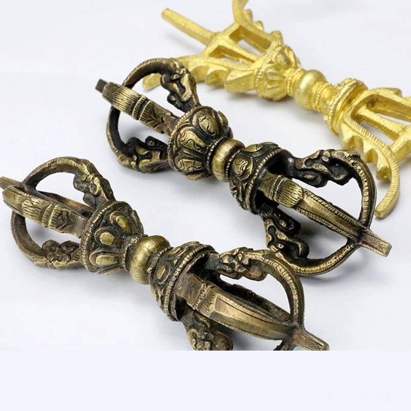 Handcrafted vajra dorje showing detailed relief carvings and natural copper patina from traditional Nepalese craftsmanship