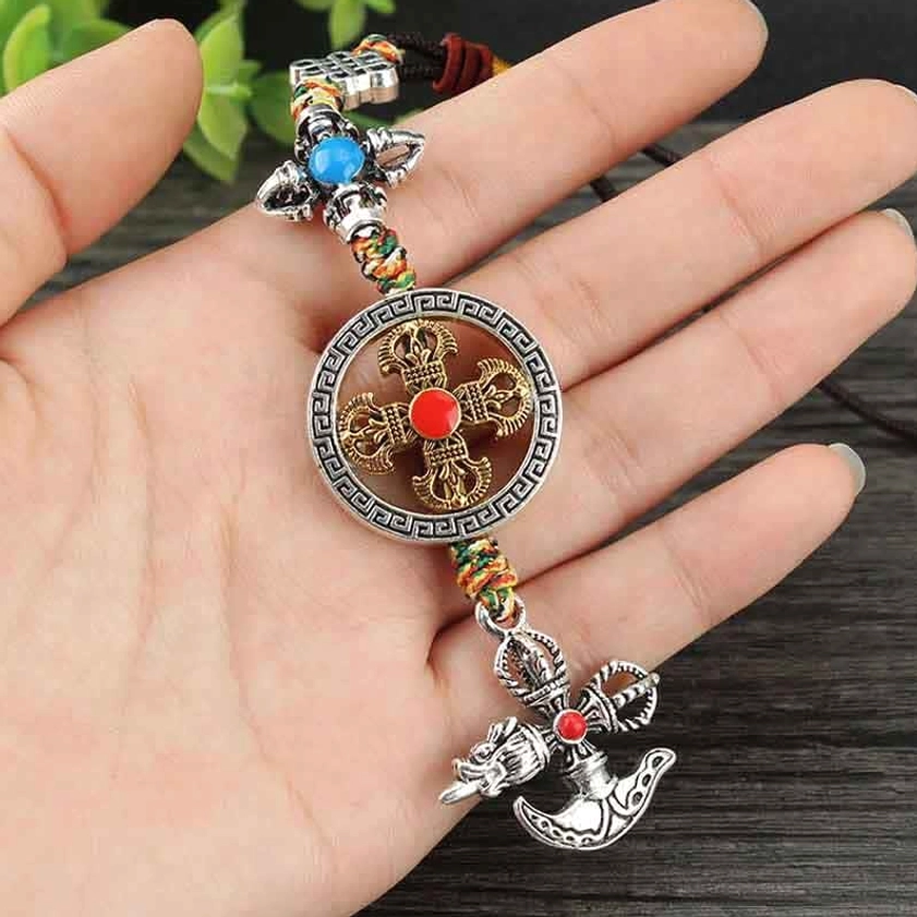 Vajra car hanging decoration held in palm showing actual size reference and silver vajra axe pendant
