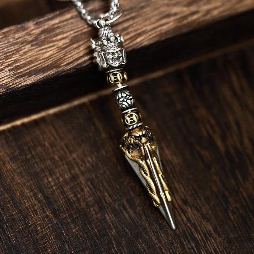 Vajrakila copper Buddhist necklace pendant with dual-tone silver and gold finish, ritual dagger design detail view