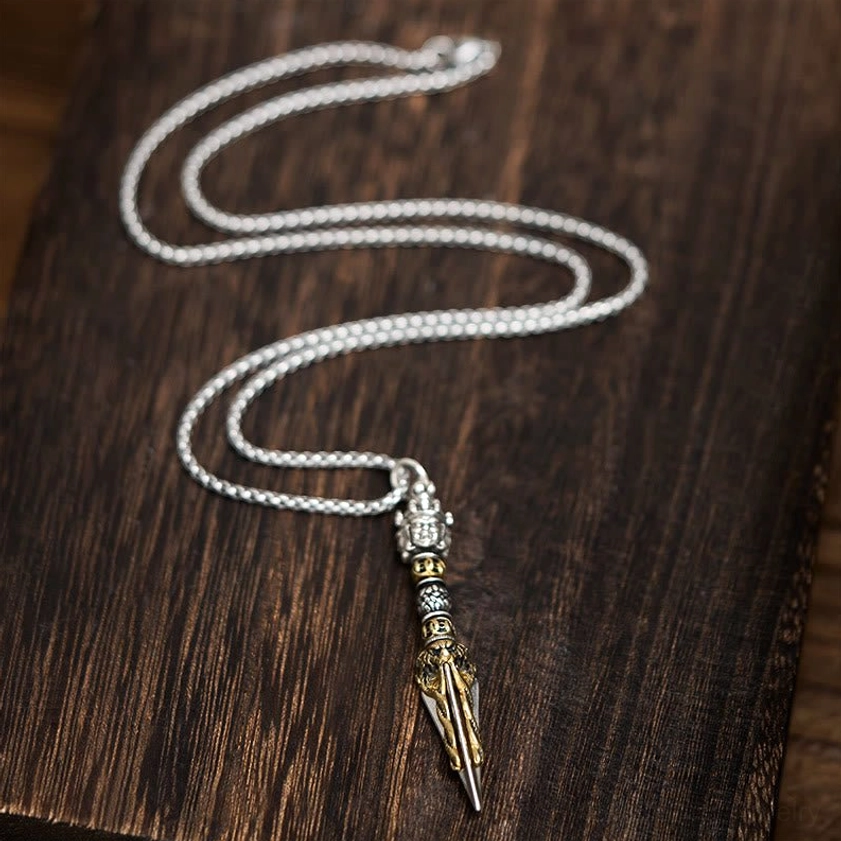 Vajrakila Buddhist necklace with coiled silver wheat-link chain and detailed carved ritual dagger pendant