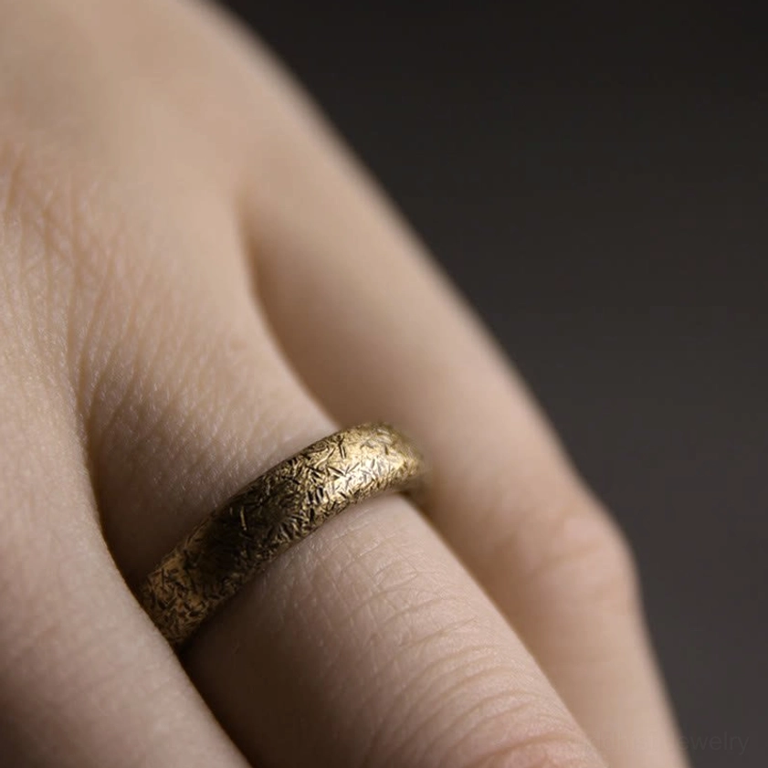 Vintage copper Buddhist couple ring showing intricate handcrafted details and spiritual significance