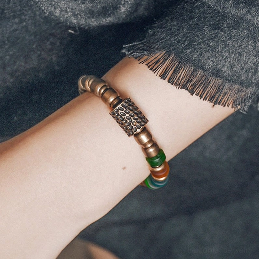 Vintage copper minimalist bracelet side wrist view with rectangular hammered metal accent and plain copper beads