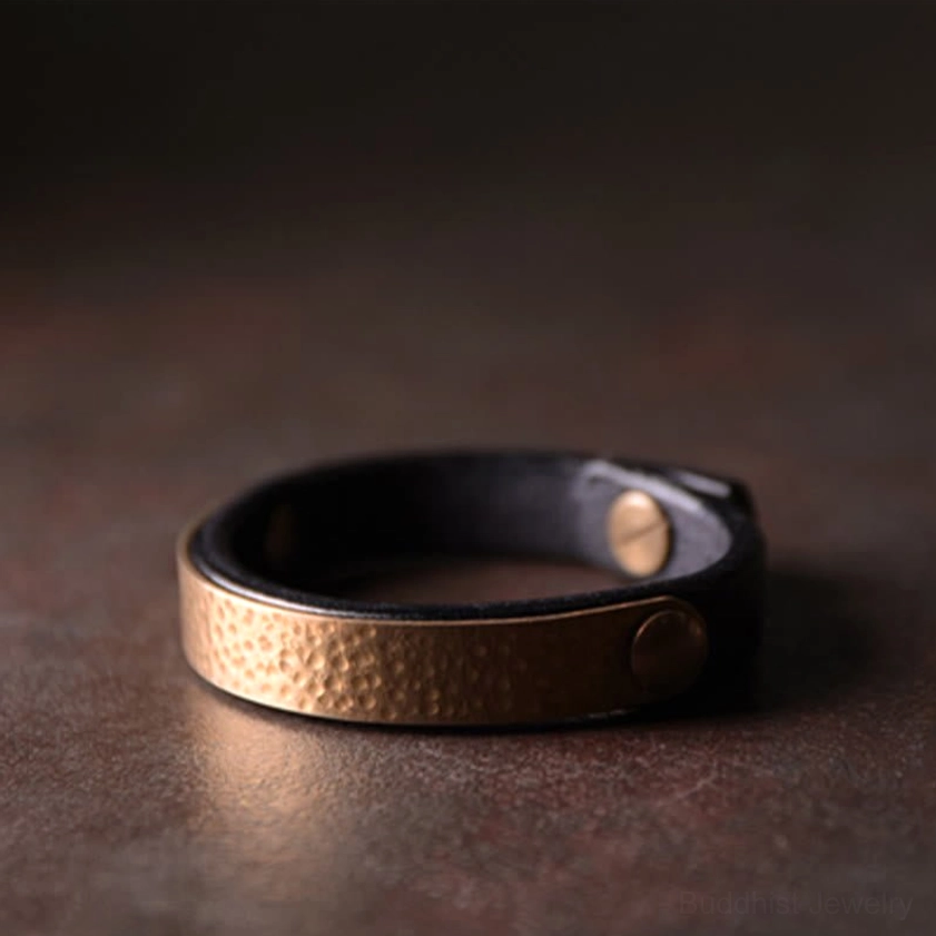 Vintage-inspired leather and brass bangle bracelet combining heritage design with modern spiritual purpose