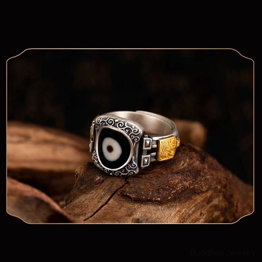 Retro-style sterling silver and gold mixed Dzi bead ring for spiritual protection and wealth attraction, left front perspective display