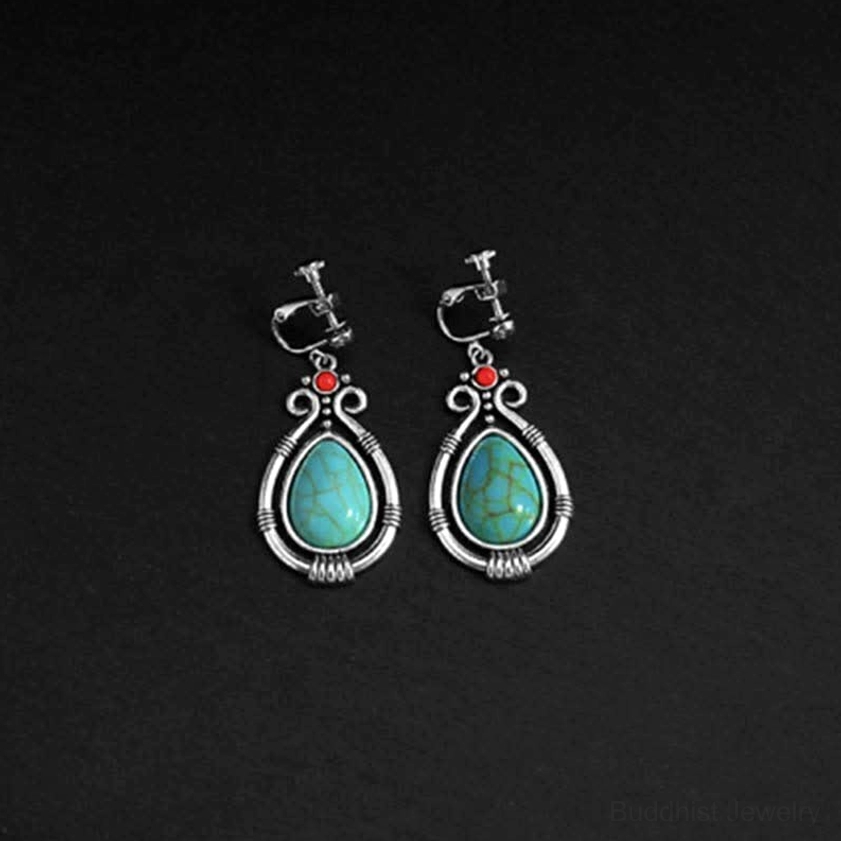 Vintage turquoise drop earrings featuring authentic Buddhist design with natural stone beauty