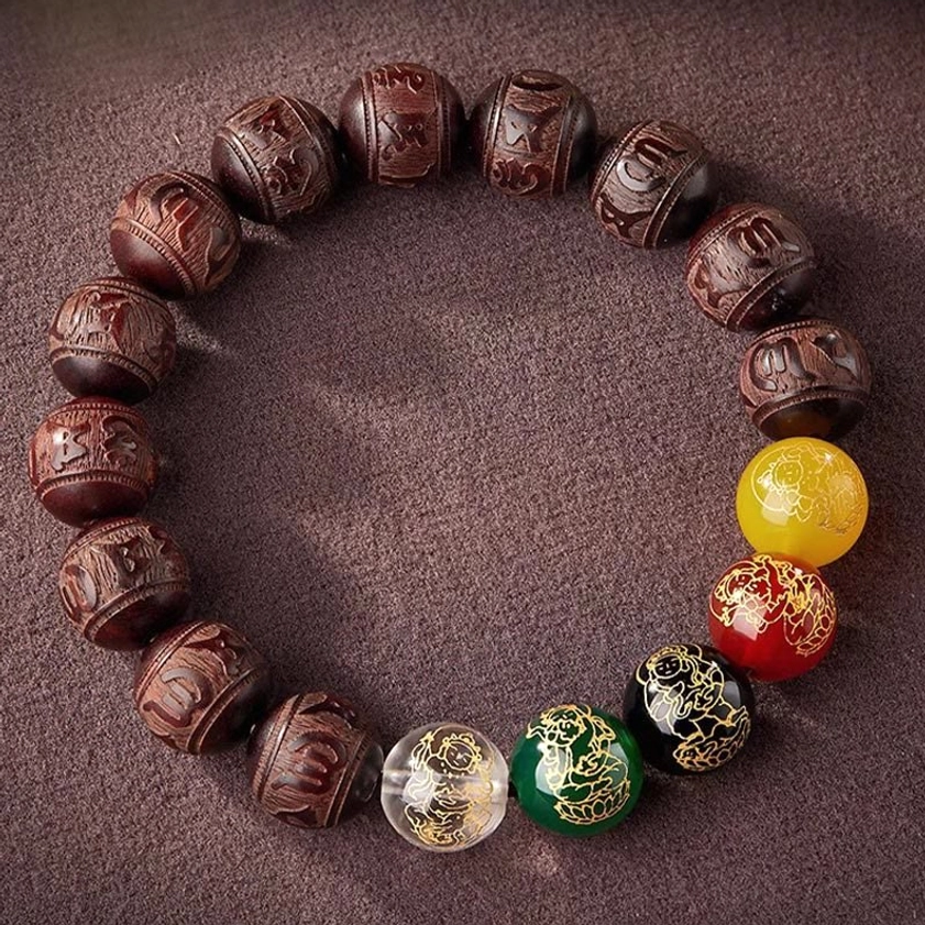 Handcrafted wealth attraction bracelet featuring traditional Buddhist symbolism and natural wood beads