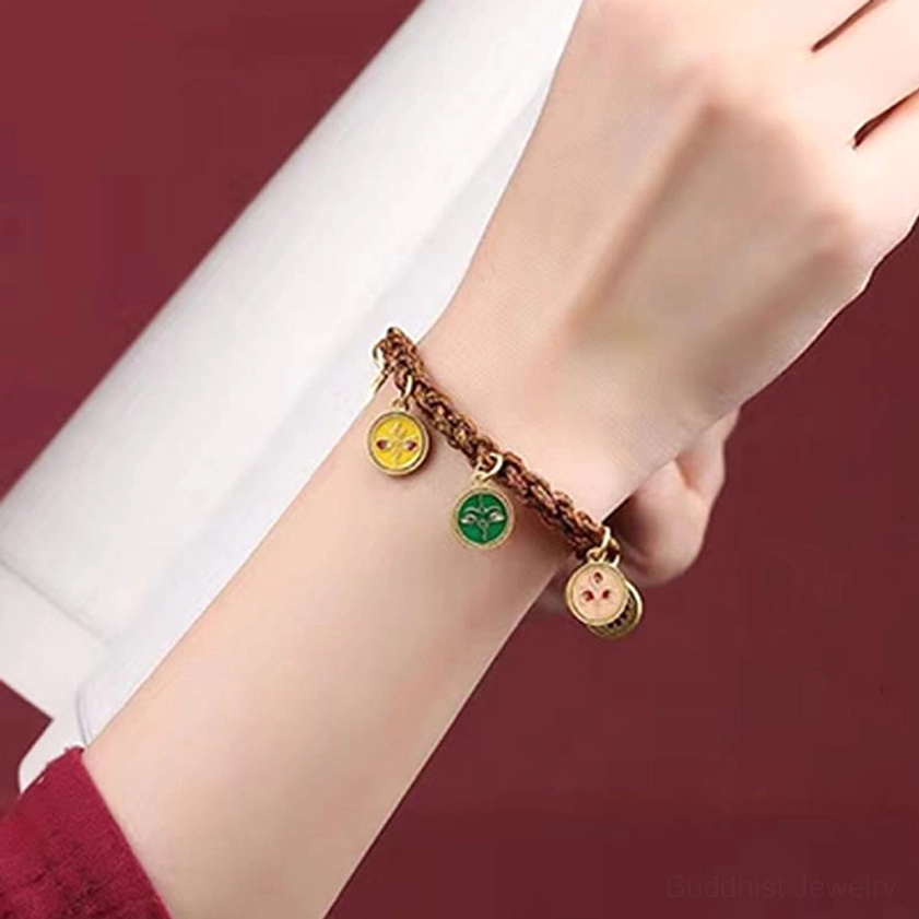 Side view of five wealth deities bracelet with braided rope and round enamel pendants - wrist wear