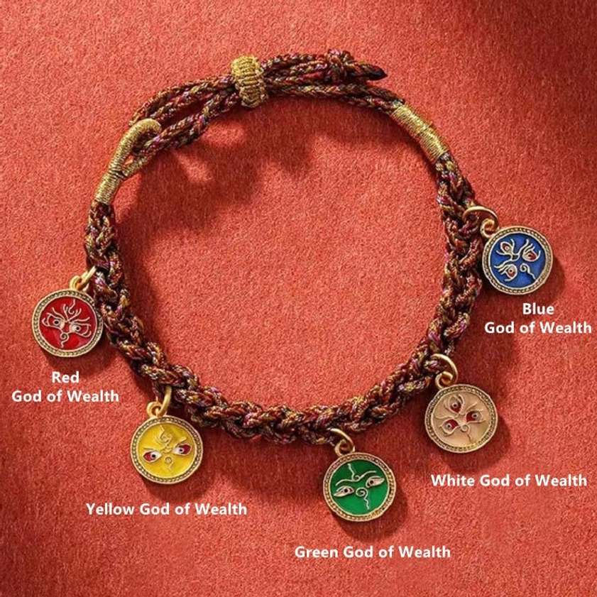 Labeled five wealth deities braided bracelet flat lay showing all pendants with Buddhist prosperity symbols