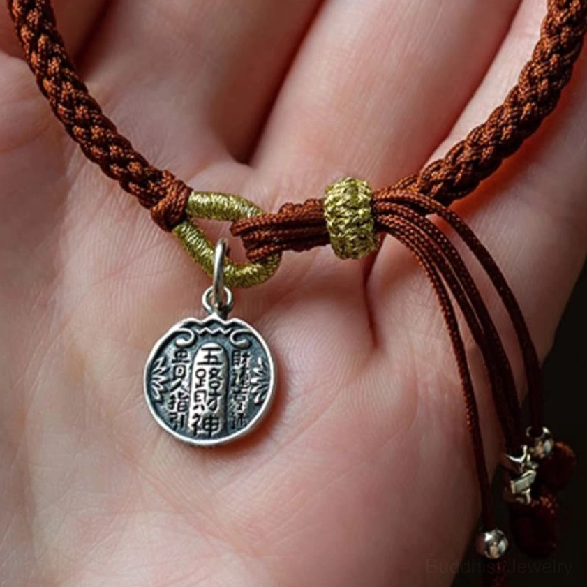 Handcrafted eight-strand braid bracelet on palm display showing engraved Chinese characters silver charm detail