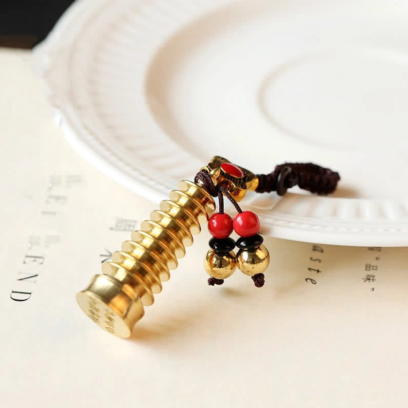 Wenchang Pagoda brass Buddhist keychain - multi-layered pagoda charm with red bead and brass bell tassels - oblique view