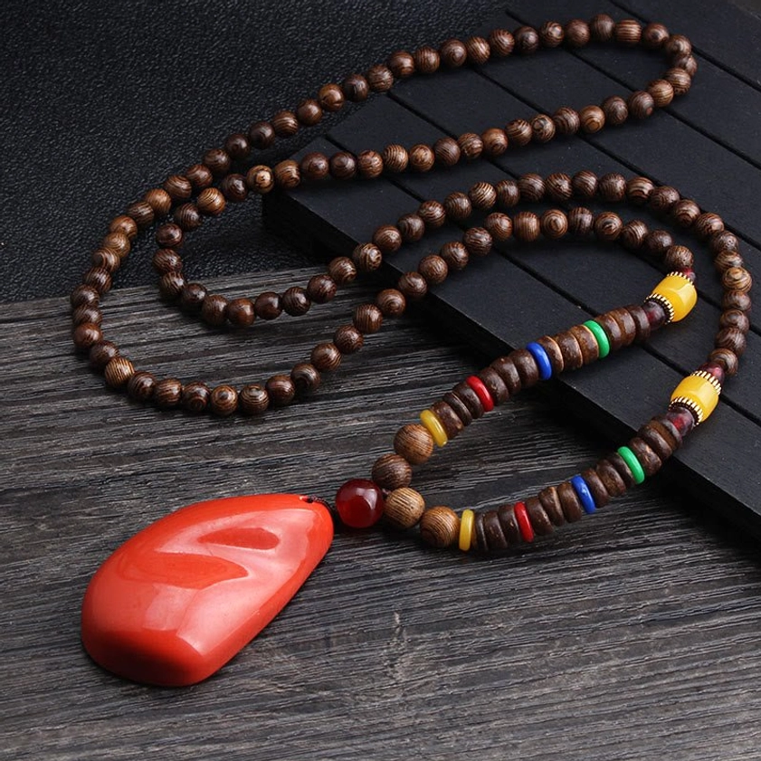 Long Wenge wood beaded necklace with large red stone pendant and colorful decorative agate spacer beads